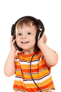 smiling baby with headphones